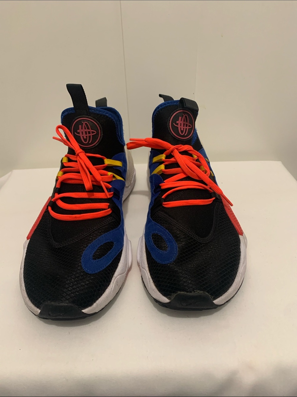 Nike Black Athletic Sneakers with Blue Accents and Bright Orange Laces